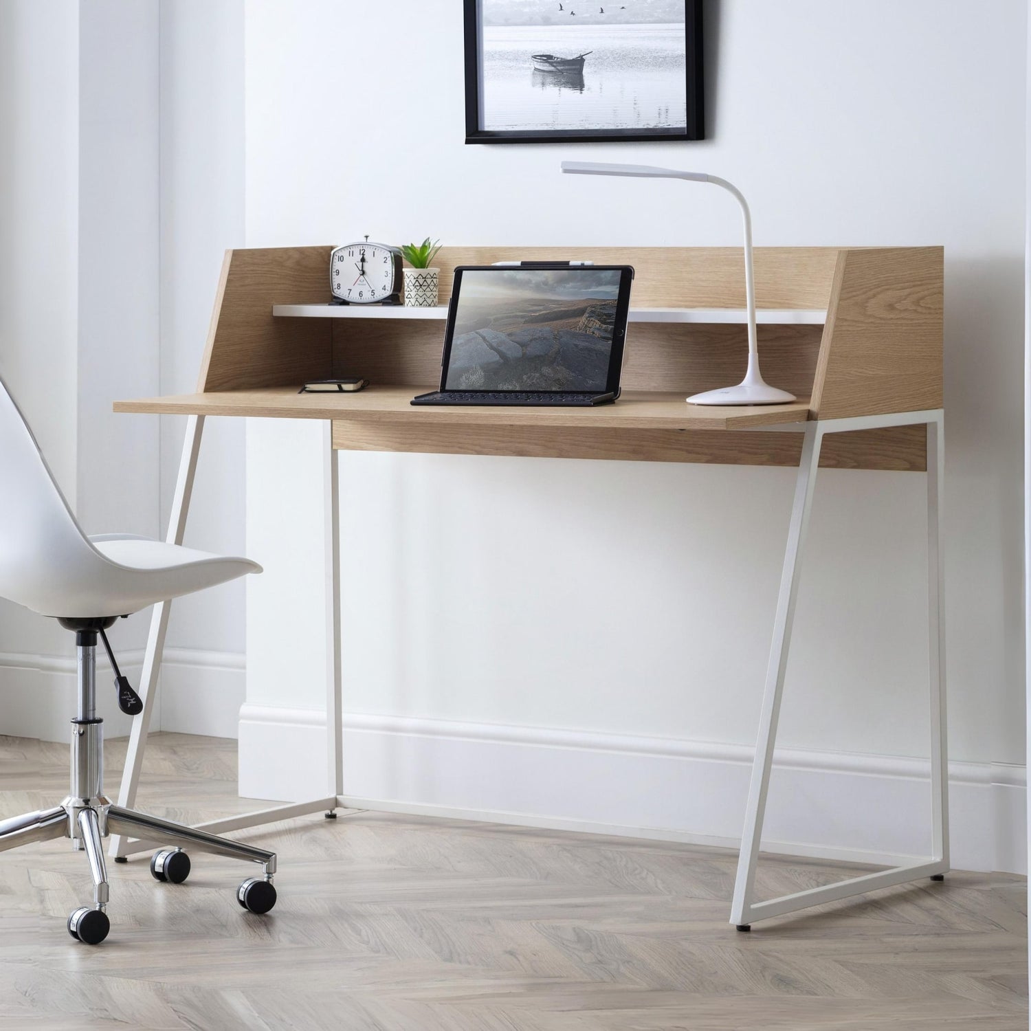 Modern wooden desk with white chair in a minimalistic room
