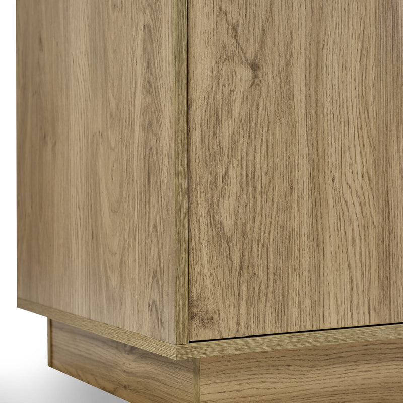 Close-up of a wooden cabinet with a light wood finish.