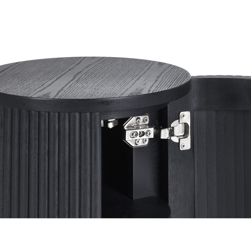 Close-up of a black wooden stool with a round top and visible hinges.