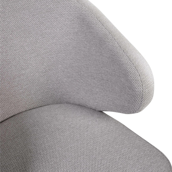 Close-up of a gray fabric chair with a plain background