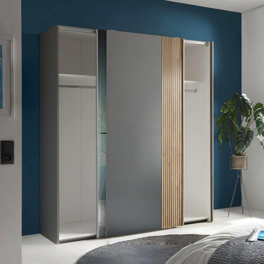 Modern wardrobe with sliding doors in a bedroom setting
