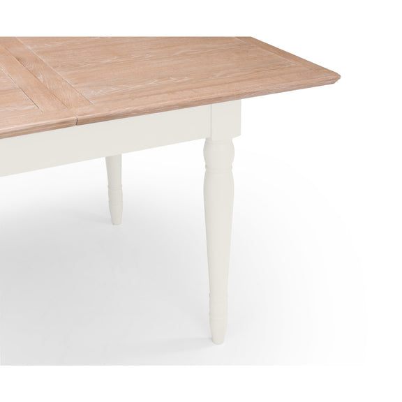 Wooden dining table with white base on a white background