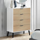 White dresser with wooden drawers in a bedroom setting