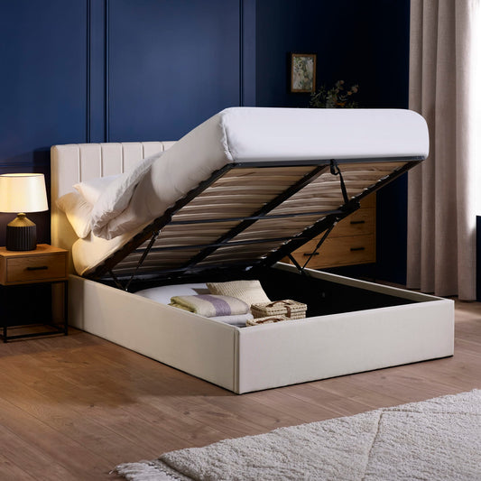 White bed with storage compartment in a bedroom setting