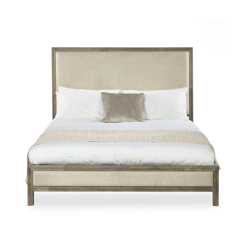 Bed with beige upholstered headboard and white bedding on a white background