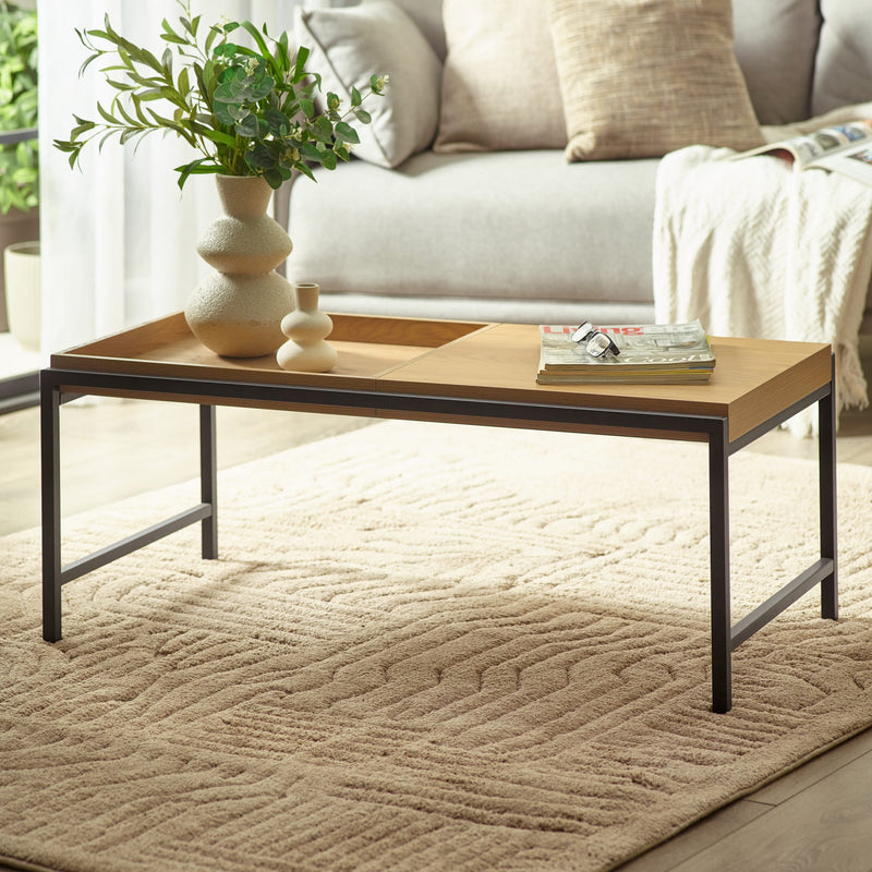 Wooden coffee table with decorative items in a living room setting