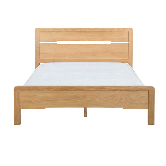 Wooden bed frame with white mattress on a white background