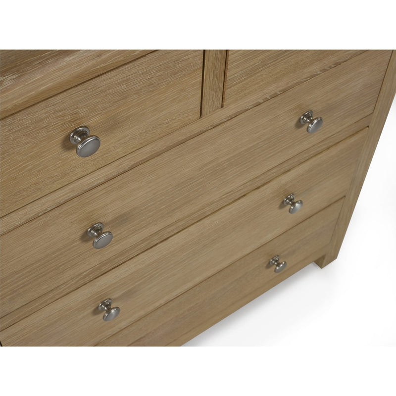 Wooden dresser with silver knobs on a white background