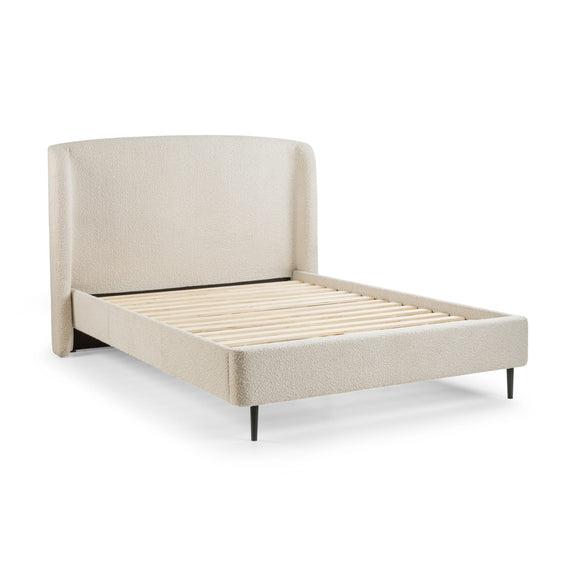 Beige upholstered bed with slatted bed frame on a white background