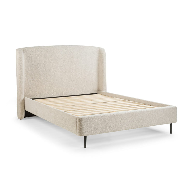 Beige upholstered bed with slatted bed frame on a white background