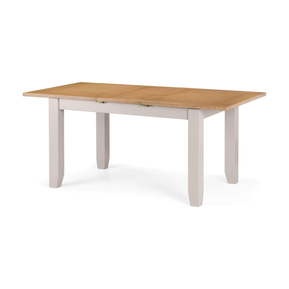 Wooden dining table with white base on a white background