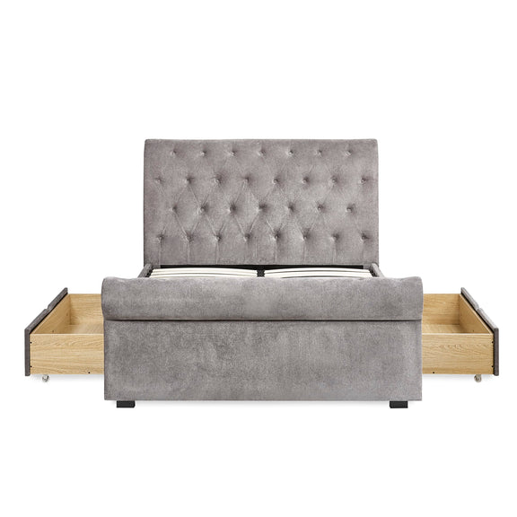 Gray upholstered bed with wooden drawers on a white background