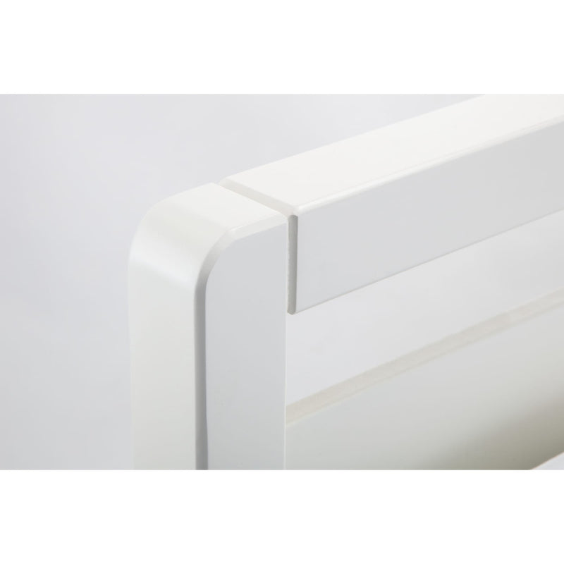 Close-up of a white rectangular object with a smooth surface on a light gray background