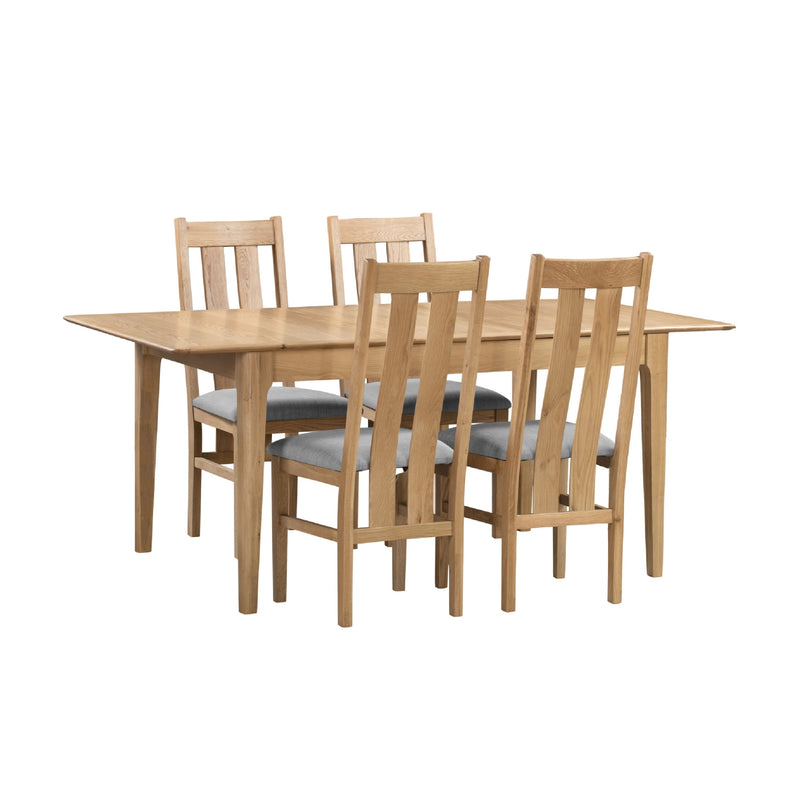 Wooden dining table with four matching chairs on a white background