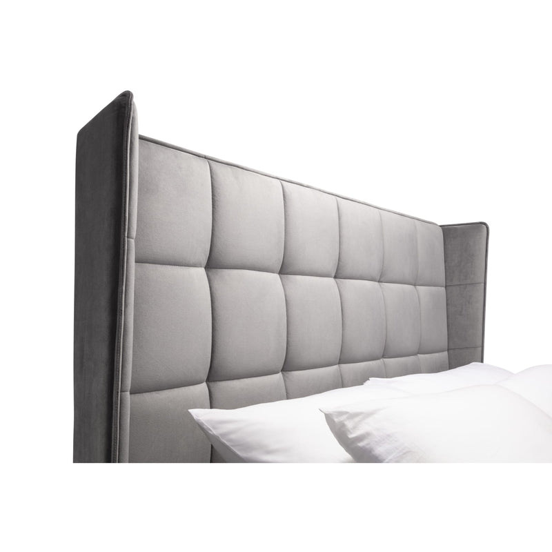 Gray upholstered headboard with tufted design on a white background