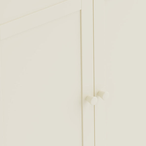 Close-up of a white cabinet with gold handles on a white background