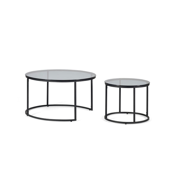 Two round glass tables with black metal frames on a white background