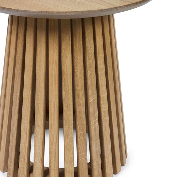 Wooden side table with a round top and slatted design on a white background