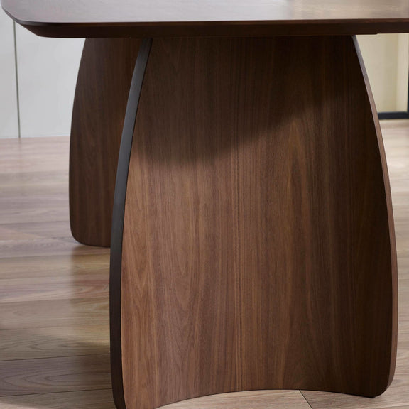 Wooden table with a modern design on a wooden floor.