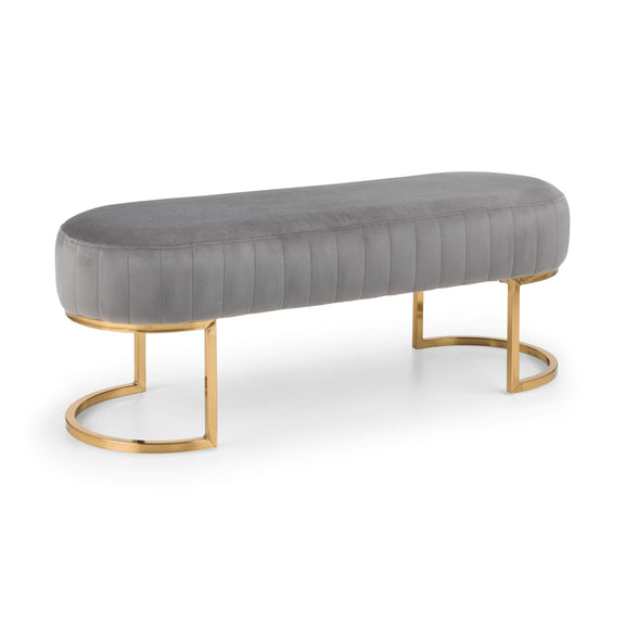 Gray upholstered bench with gold metal legs on a white background