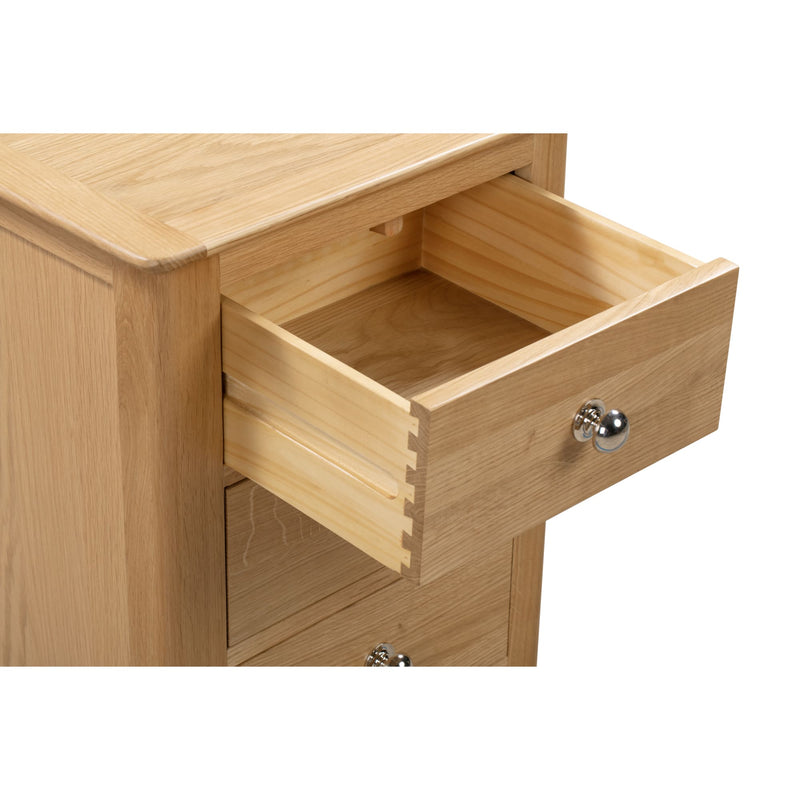 Wooden drawer with a metal handle on a white background