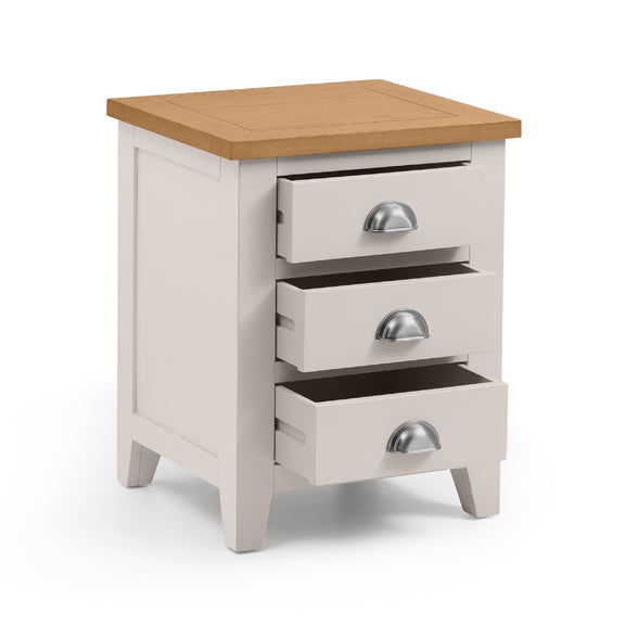 Wooden nightstand with three drawers on a white background