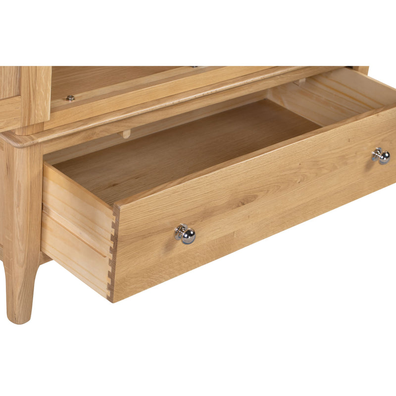 Wooden drawer with metal handles on a white background