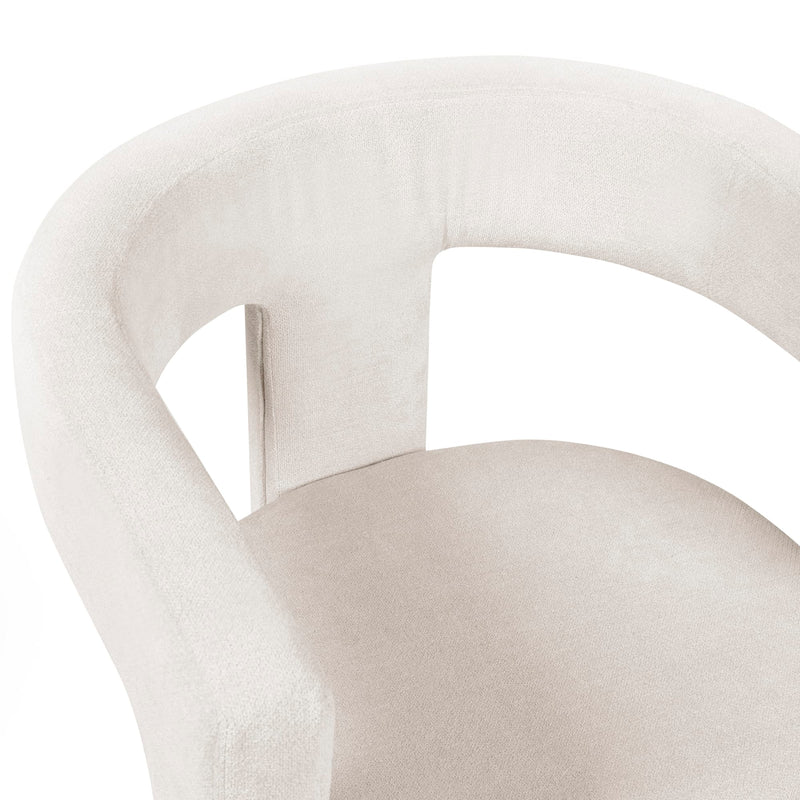 Close-up of a beige chair with a white background