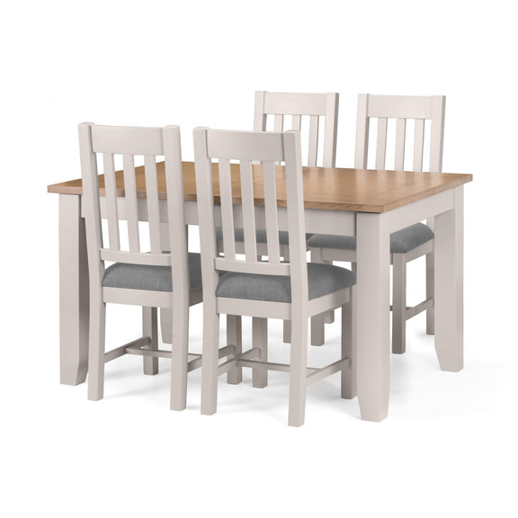 Dining table set with four chairs on a white background