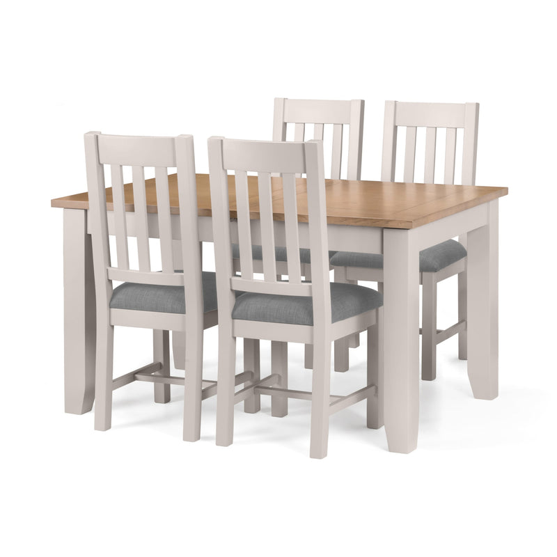 Dining table set with four chairs on a white background