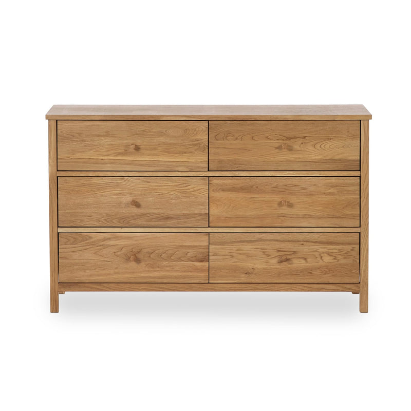 Wooden dresser with multiple drawers on a white background