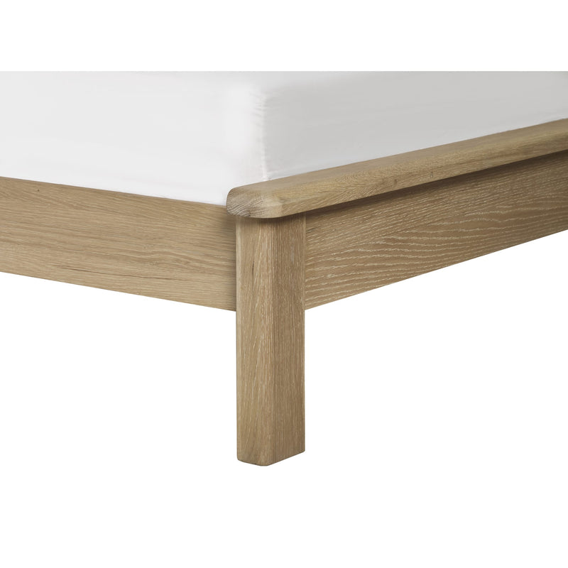 Wooden bed frame corner on a white background