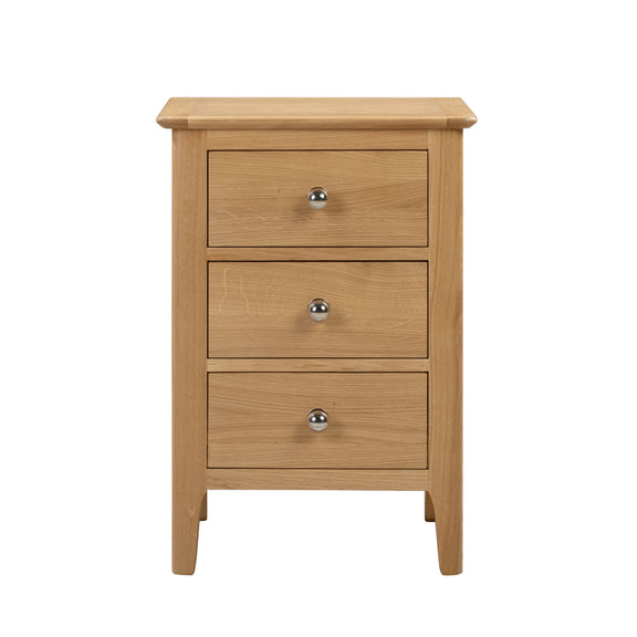 Wooden nightstand with three drawers on a white background