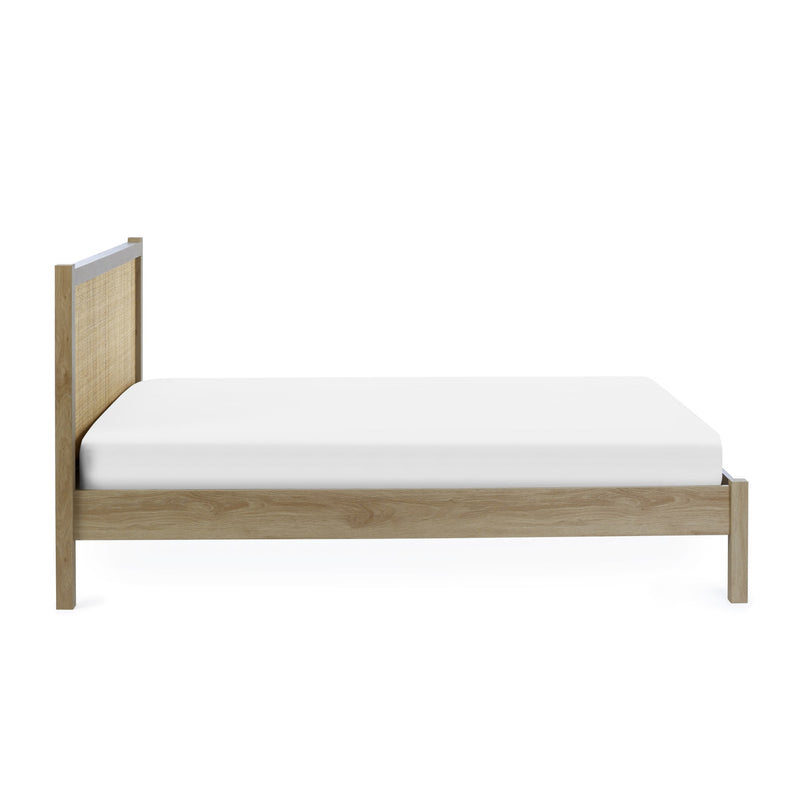 Wooden bed frame with a white mattress on a white background