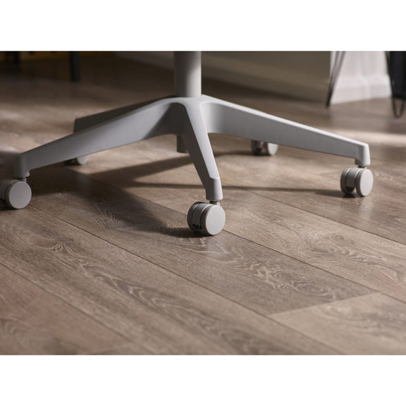 Gray office chair with wheels on a wooden floor