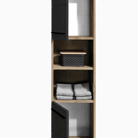 Tall wooden cabinet with shelves containing folded clothes and a basket on a white background