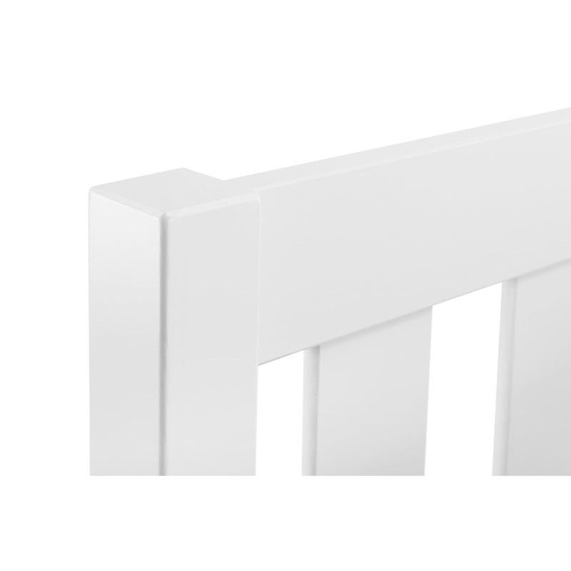 White wooden crib railing on a white background