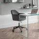 Modern office setup with a glass desk and gray chair.