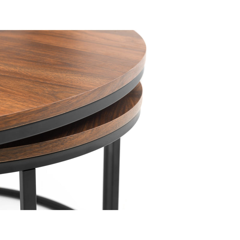 Wooden table with black metal legs on a white background