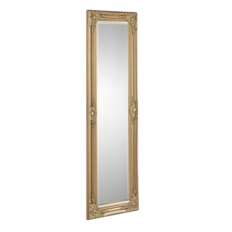 Decorative full-length mirror with ornate gold frame on a white background