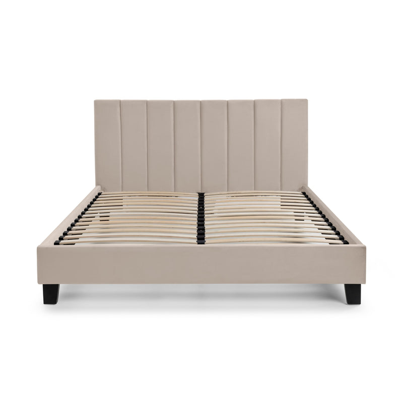 Beige upholstered bed frame on a white background