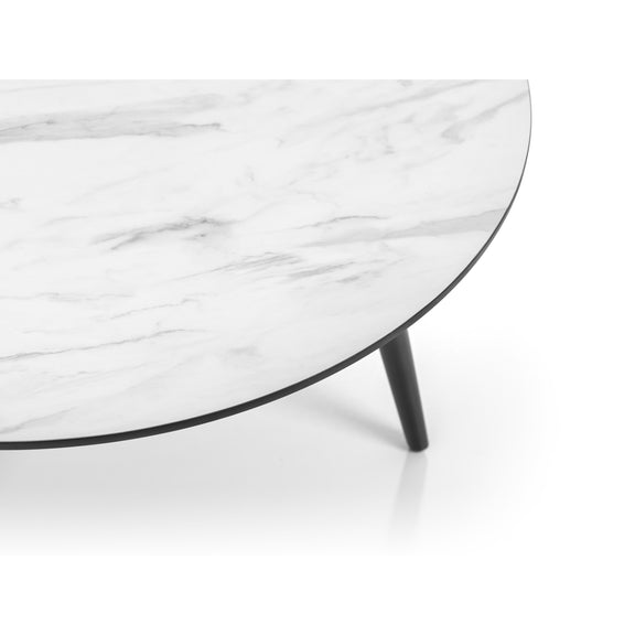 Round marble coffee table with a white and gray pattern on a white background