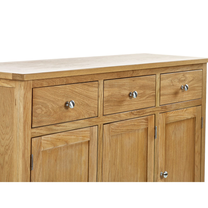 Wooden sideboard with four drawers and four doors on a white background