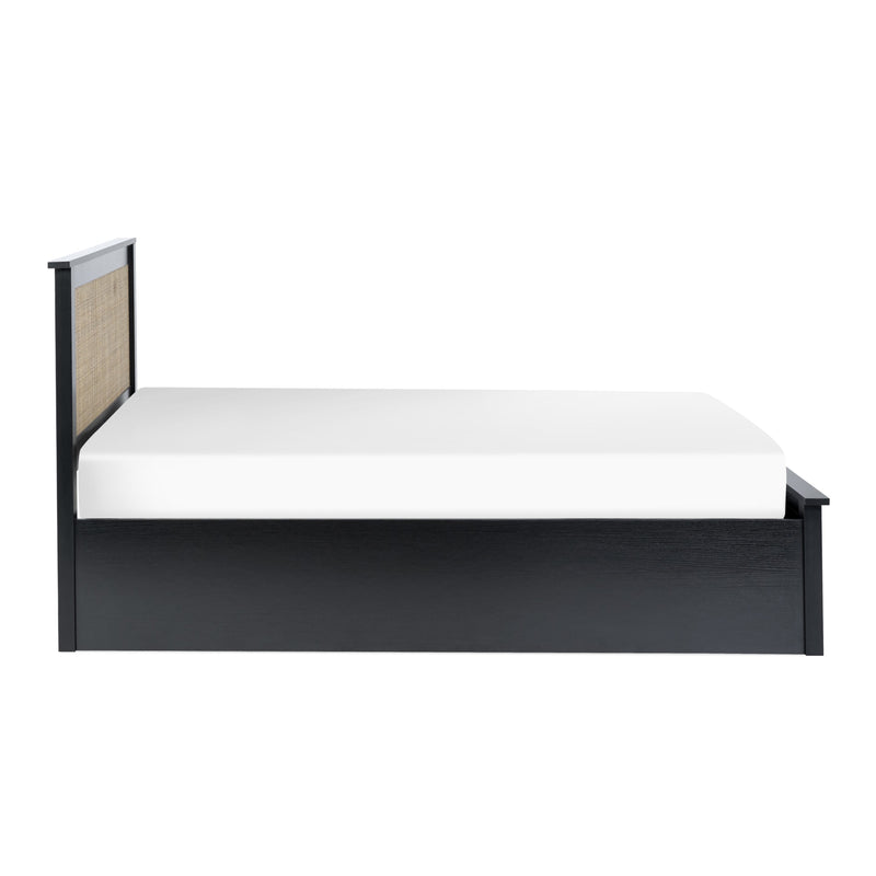 Black metal bed frame with white mattress on a white background