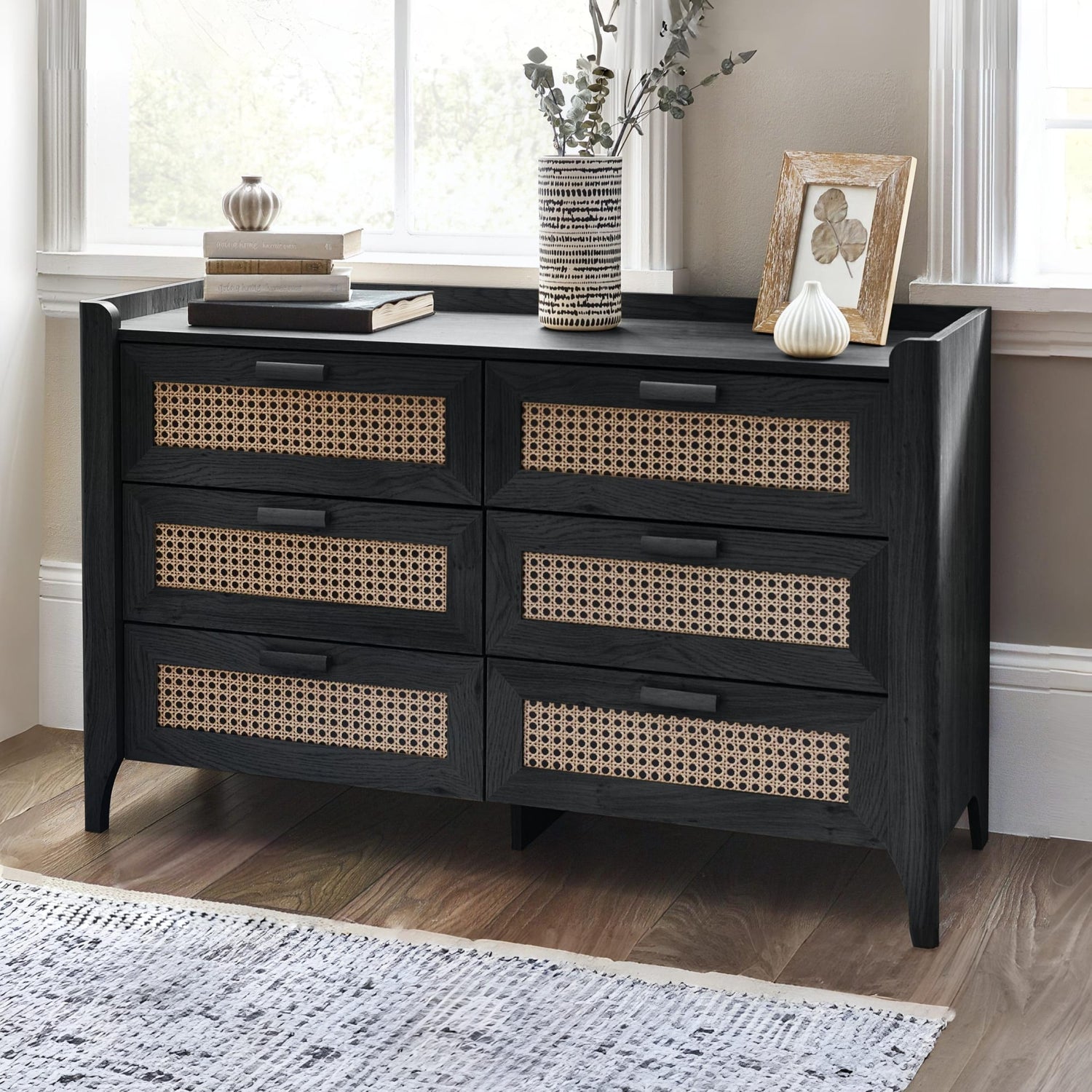 Black wooden 6 drawer chest with woven rattan drawer fronts