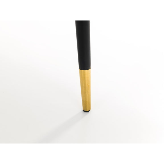 Black and gold makeup brush on a white background