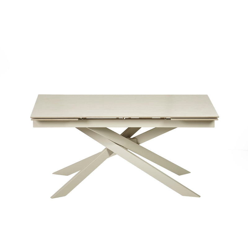 Beige extending table with X-shaped legs on a white background