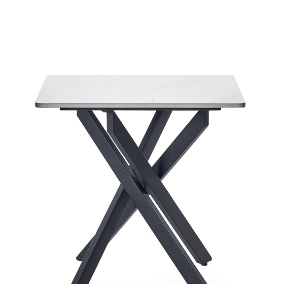 Small table with white top and black metal legs on a white background