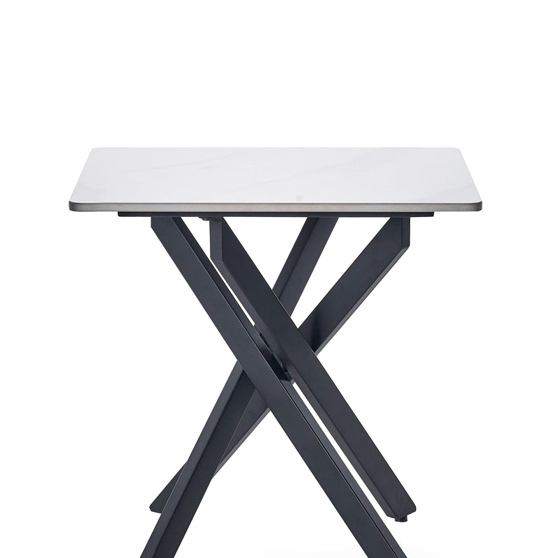 Small table with white top and black metal legs on a white background