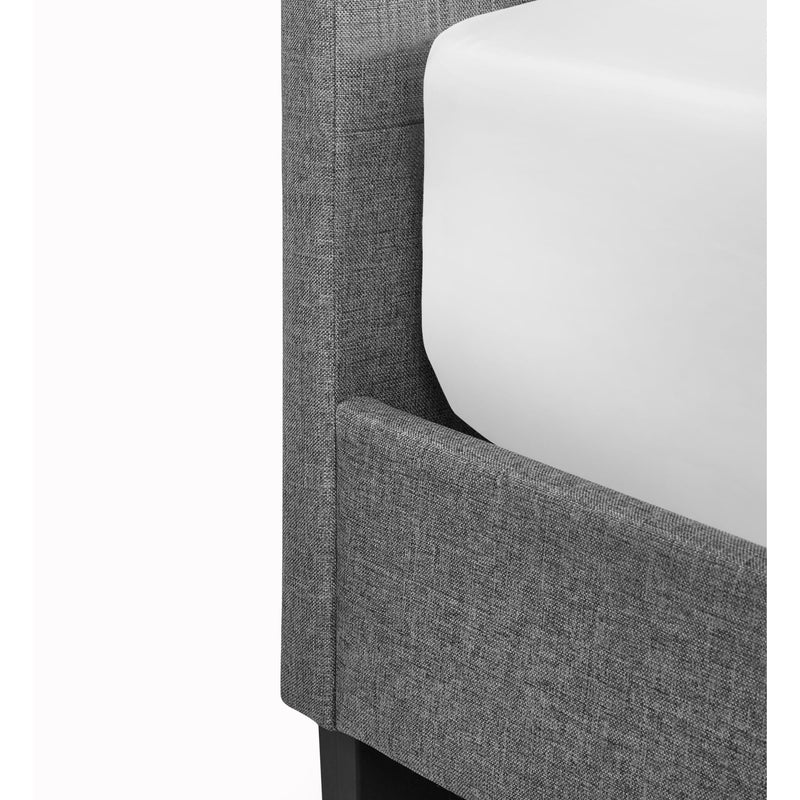 Gray upholstered chair with white cushion on a white background